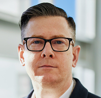 Alexander Hughes, executive portrait as CEO of a crypto trading company